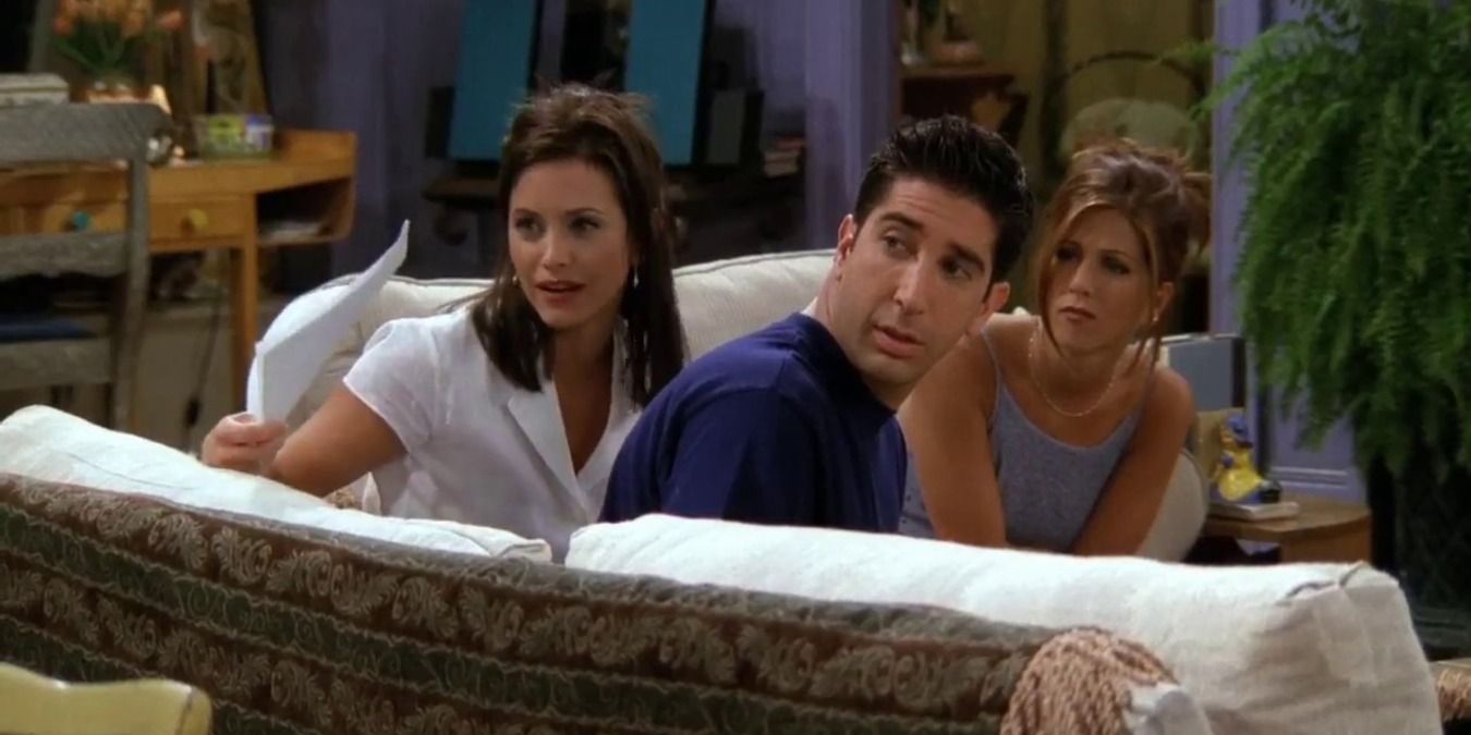 Monica, Ross, and Rachel looking at Joey with the sperm donors sheet