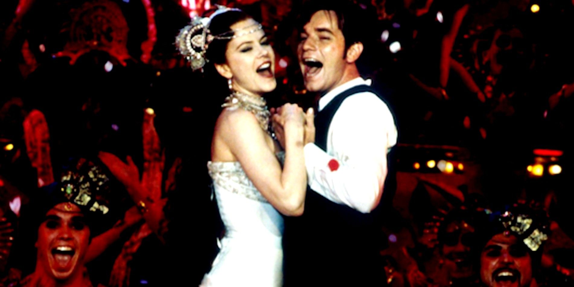 Nicole Kidman and Ewan McGregor in Moulin Rouge!, holding each other and singing