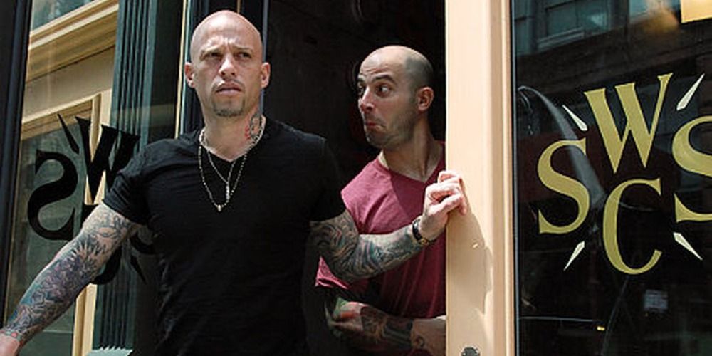 Ari James and his partner walking out of a tattoo shop in NY Ink