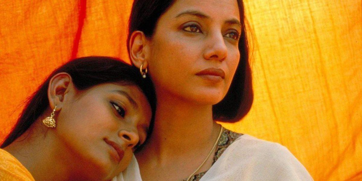 Nandita Das placing her head on Shabana Azmi's shoulder in a still from Fire