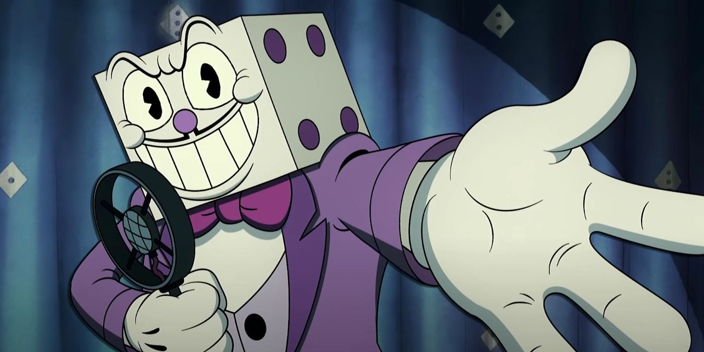 King Dice stands in front of a microphone in the Cuphead Show