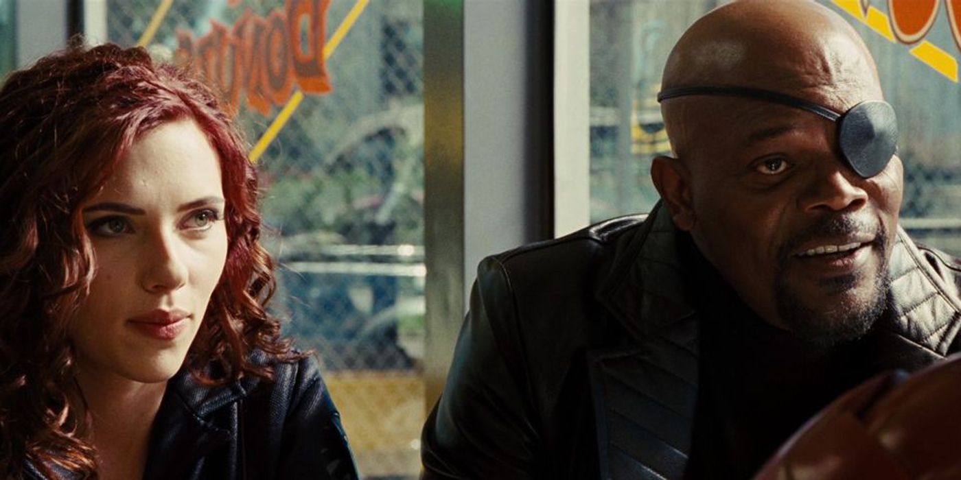 Nick Fury and Black Widow talking to Iron Man.