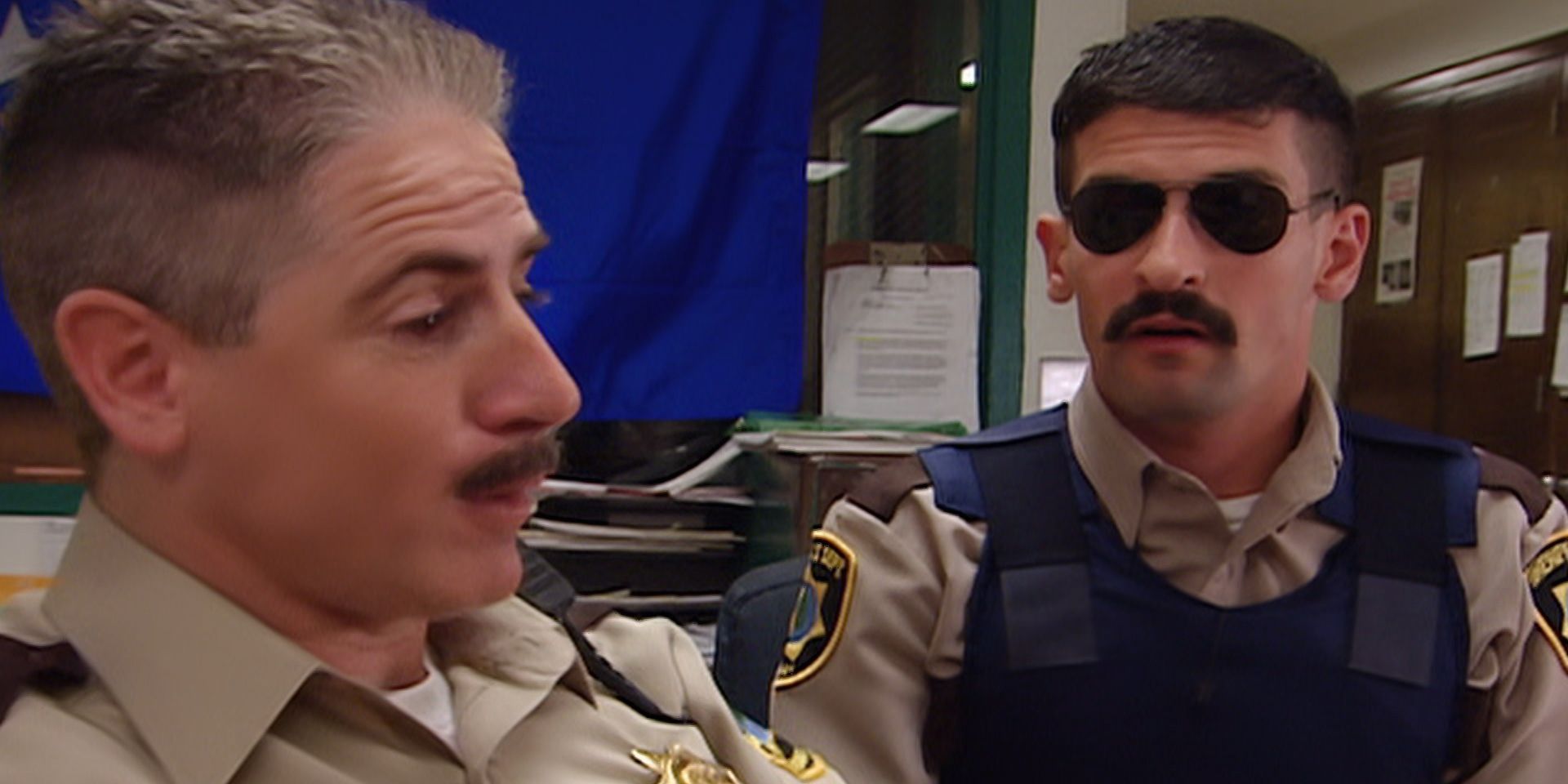 Two Reno 911 characters with mustaches
