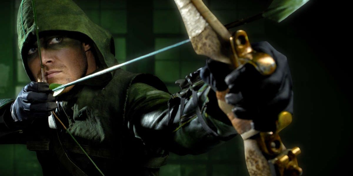 Oliver Queen wearing green eye makeup instead of a mask. 
