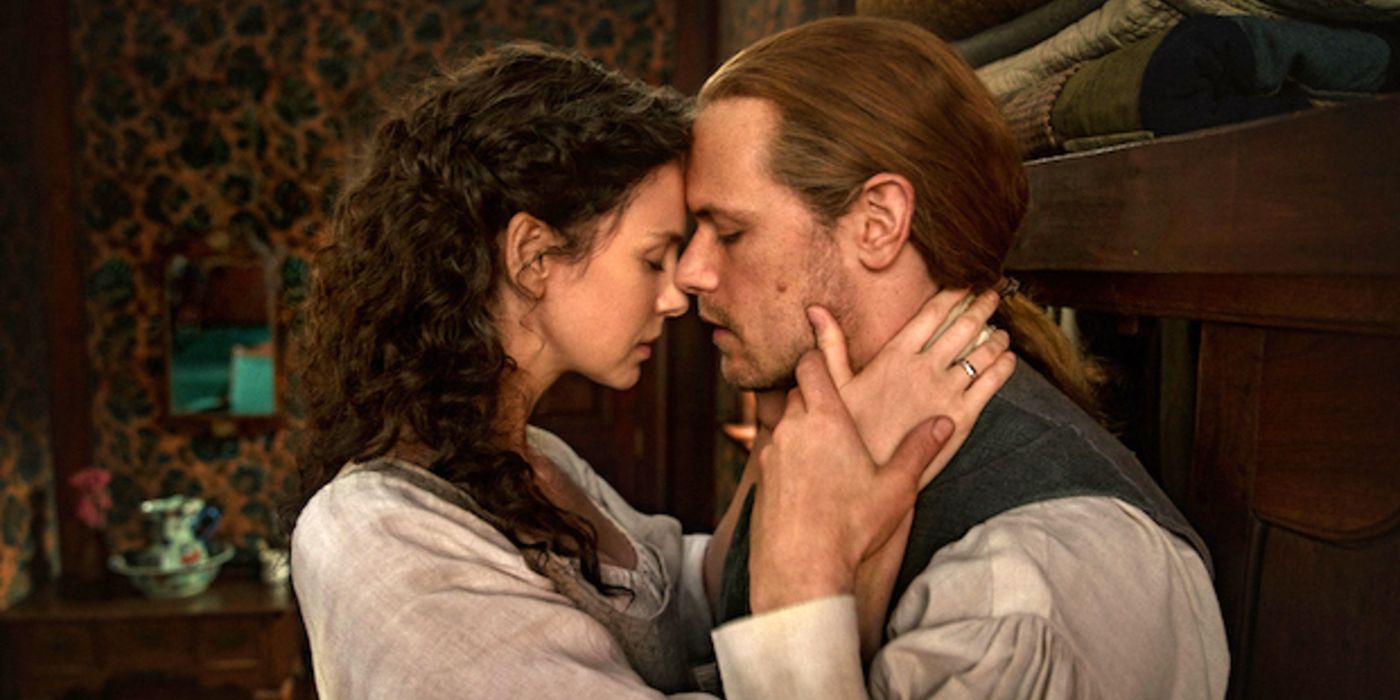 Jamie and Claire embrace with their eyes closed in Outlander