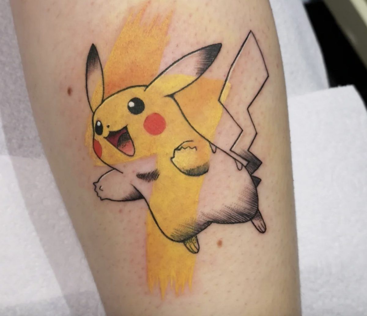 Tattoo of Pikachu with a mix of color and non-color