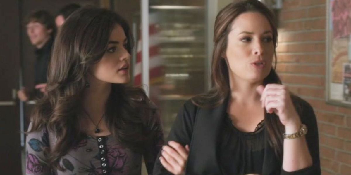 Aria holds on to and looks at ther mother