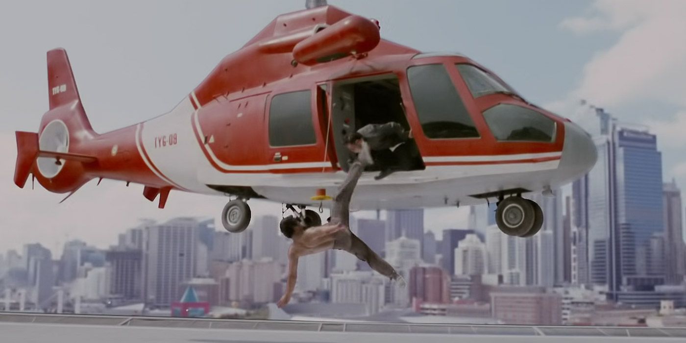 Kham jump-kicks a criminal out of a helicopter