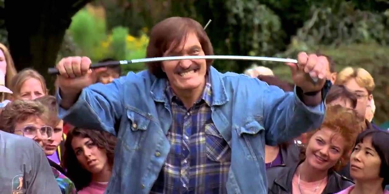 Richard Kiel as Mr Larson bending a golf club in Happy Gilmore