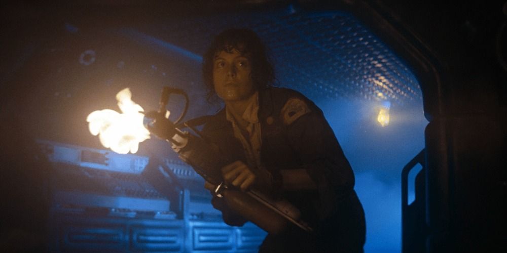 Sigourney Weaver as Ripley holding the flamethrower in the corridor in Alien (1979)