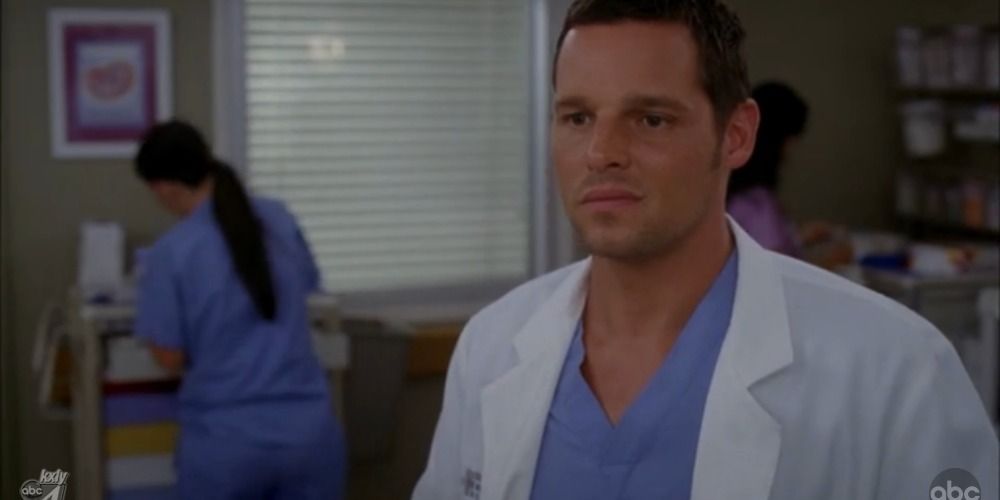 Dr. Alex Karev looks concerned as he watches something unfold before him in Grey's Anatomy.