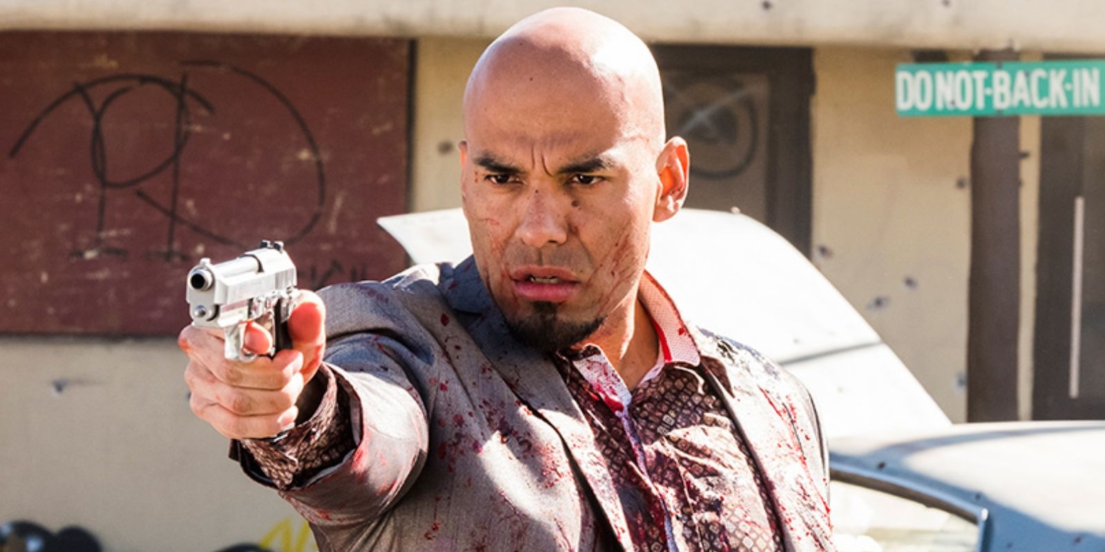 Salamanca cousin aiming gun and covered in blood in Better Call Saul