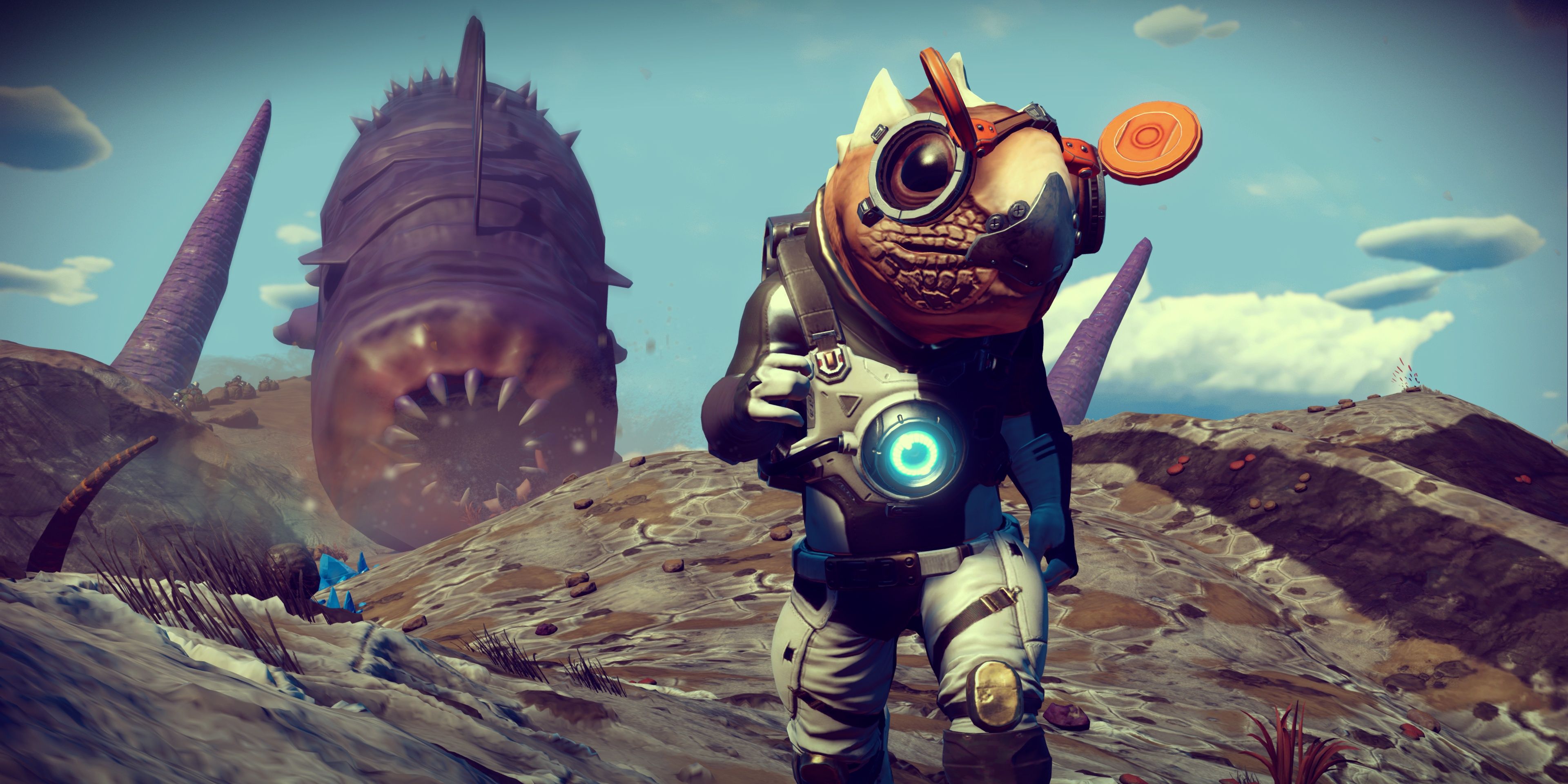 A sandworm emerges from the ground behind a Gek alien