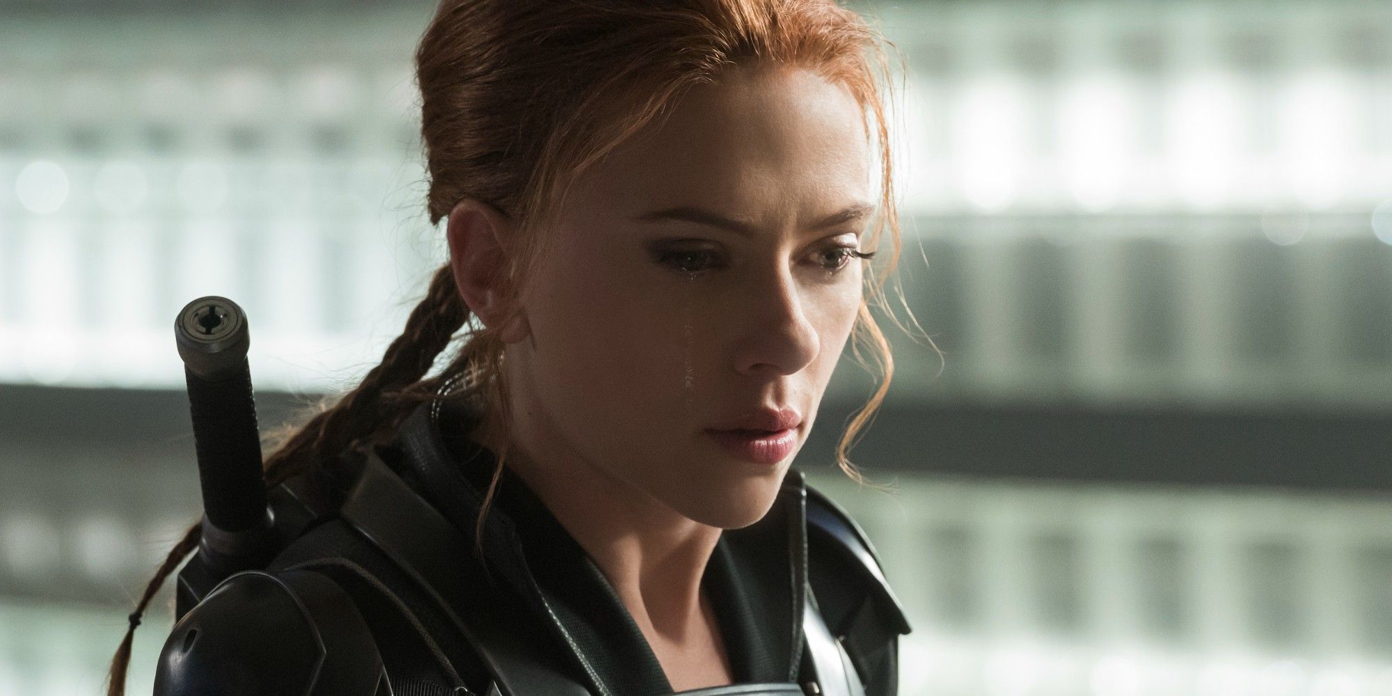 Natasha Romanoff cries and looks down in Black Widow Movie