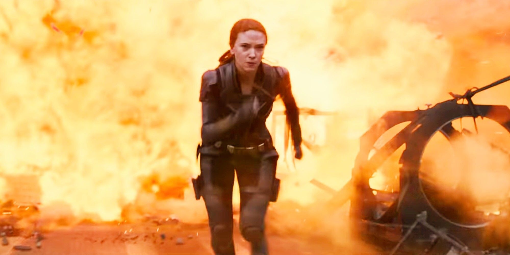 Natasha runs from an explosion in the upcoming in Black Widow Movie