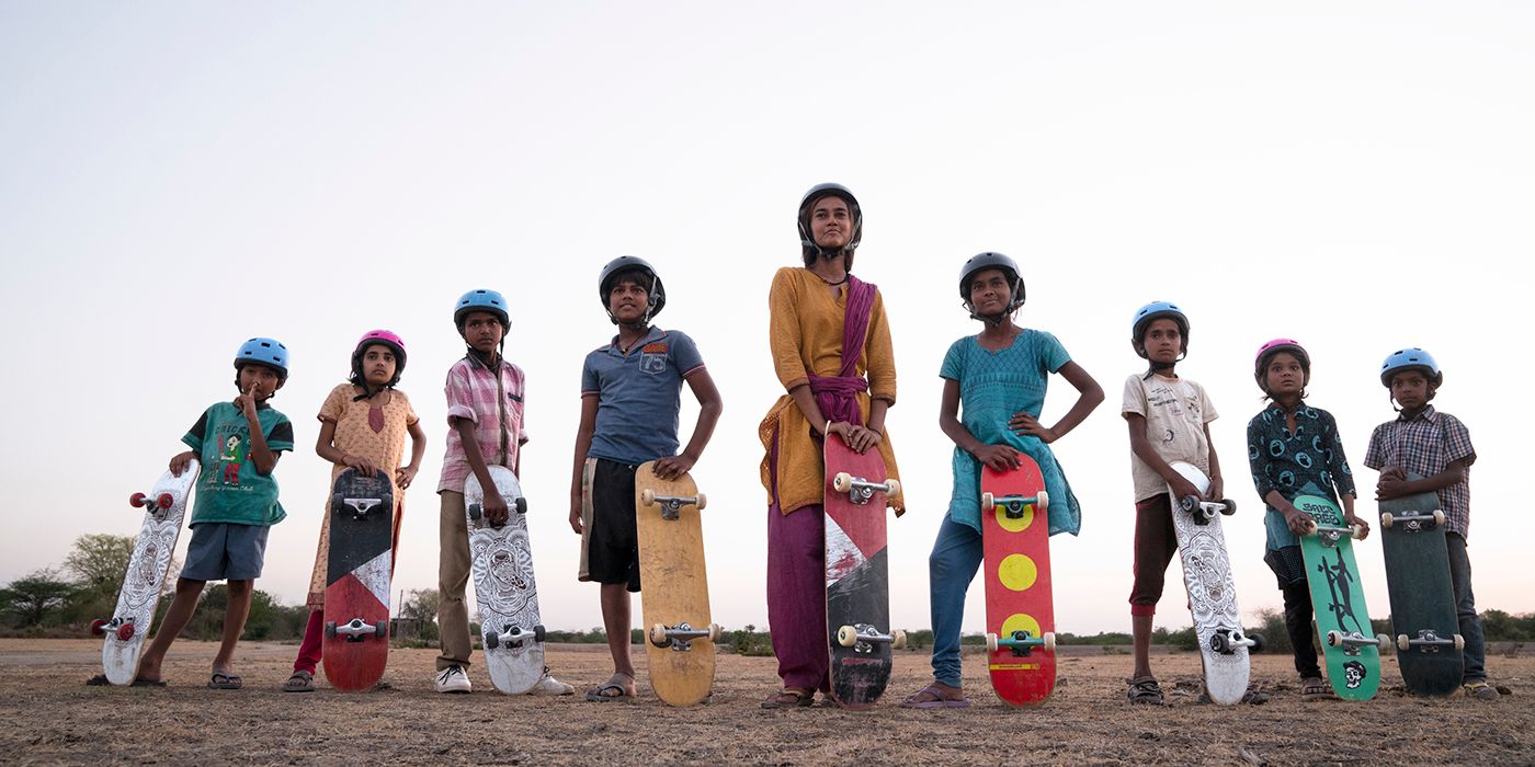 A group of children with skateboards in Skater Girl on Netflix