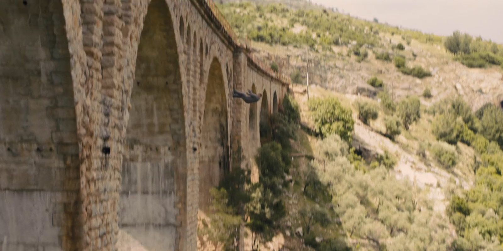 Bond falling off a bridge in Skyfall