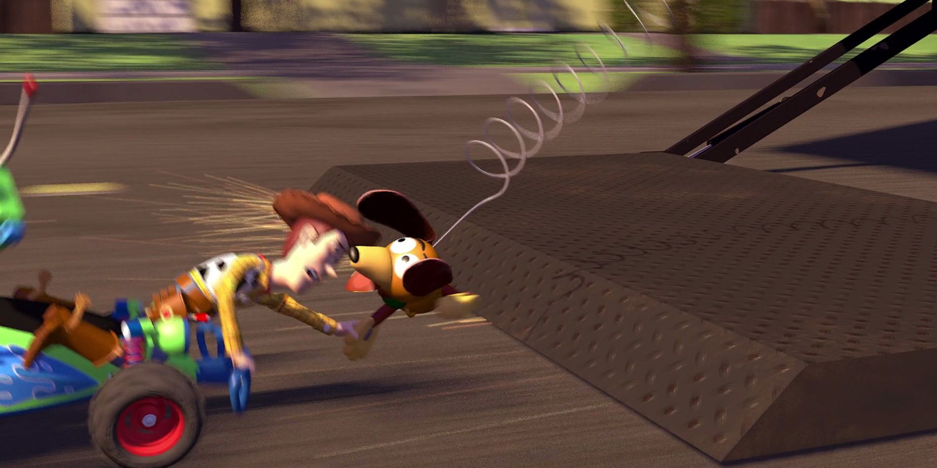 Slinky hangs on to Woody in Toy Story