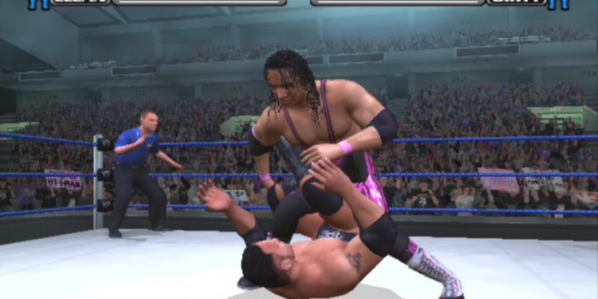Bret Hart puts the Sharpshooter on The Rock in Smackdown v Raw