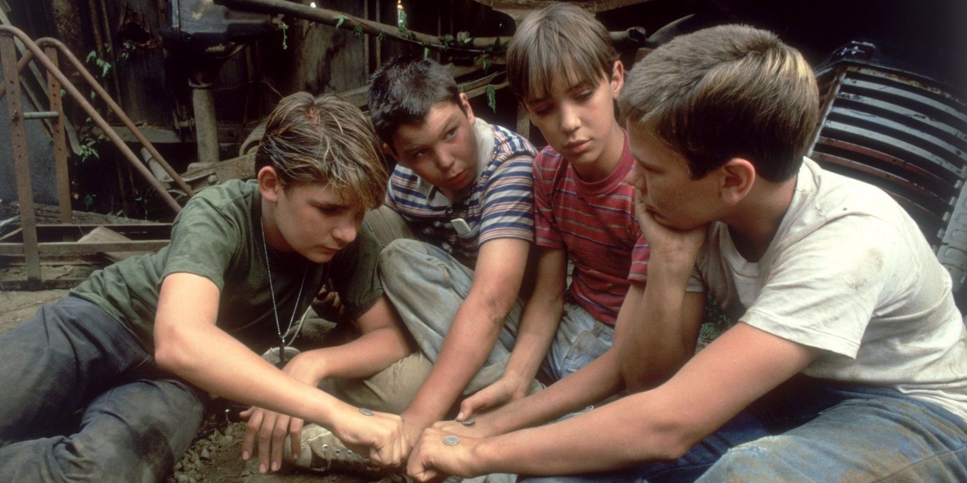 Teddy, Vern, Gordie and Chris put their hands together in Stand By Me