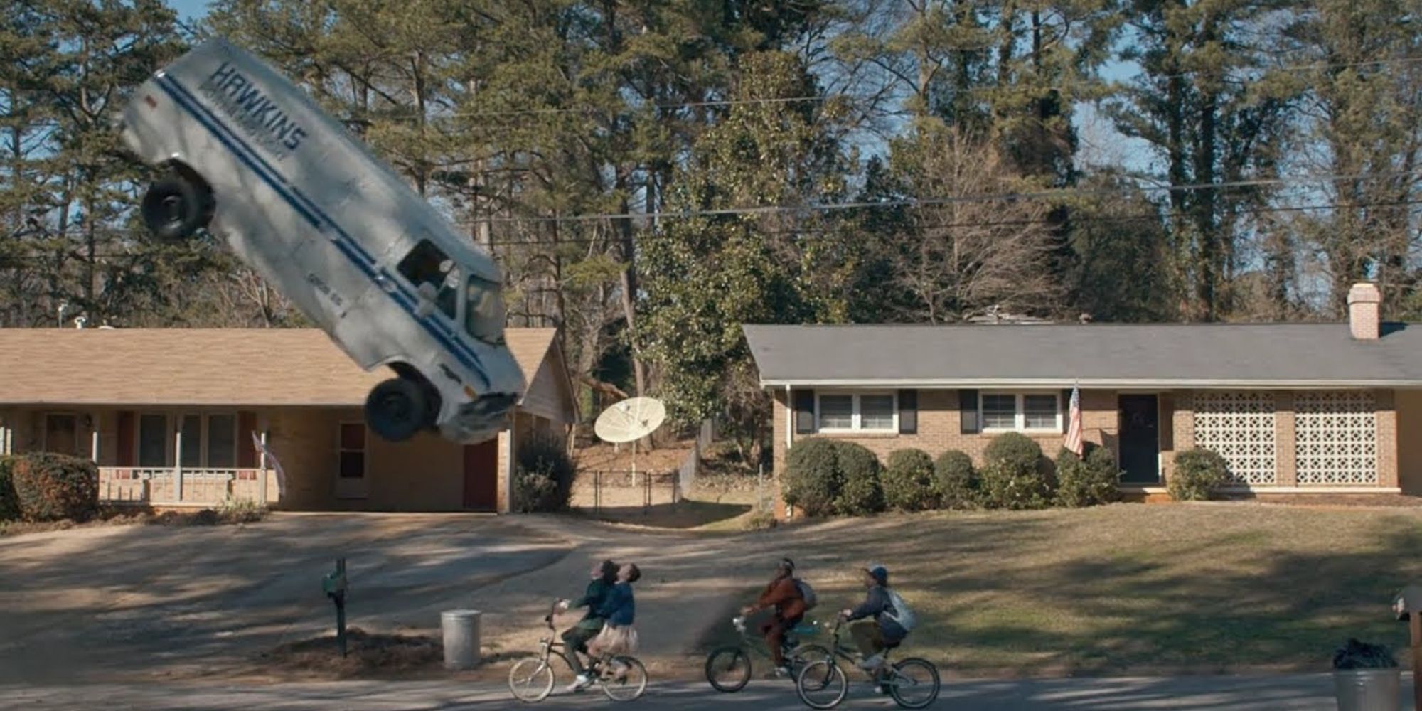 Eleven uses her powers to flip the van in Stranger Things