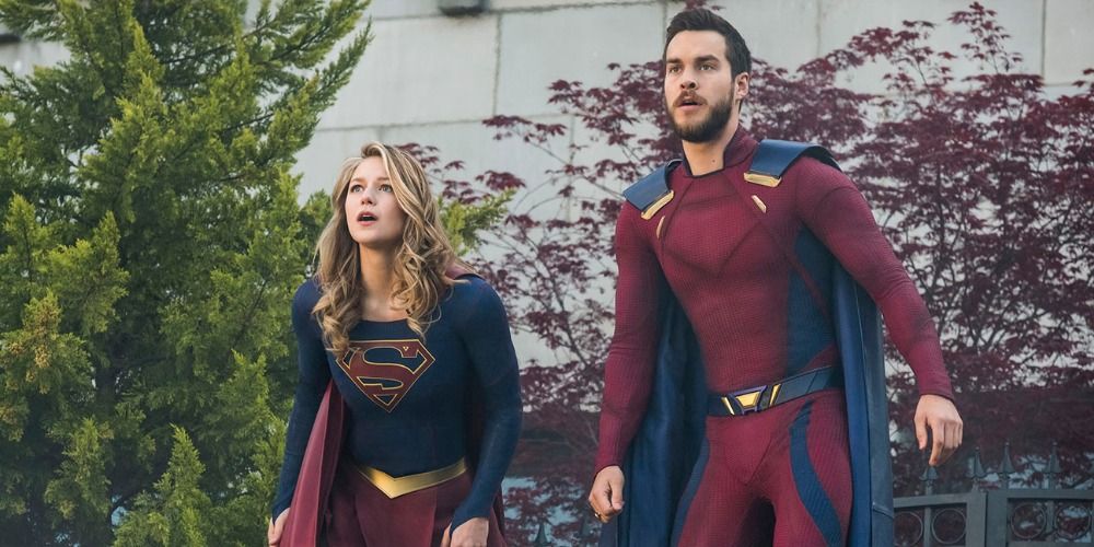 Kara and Mon-El stand side by side outside in Supergirl