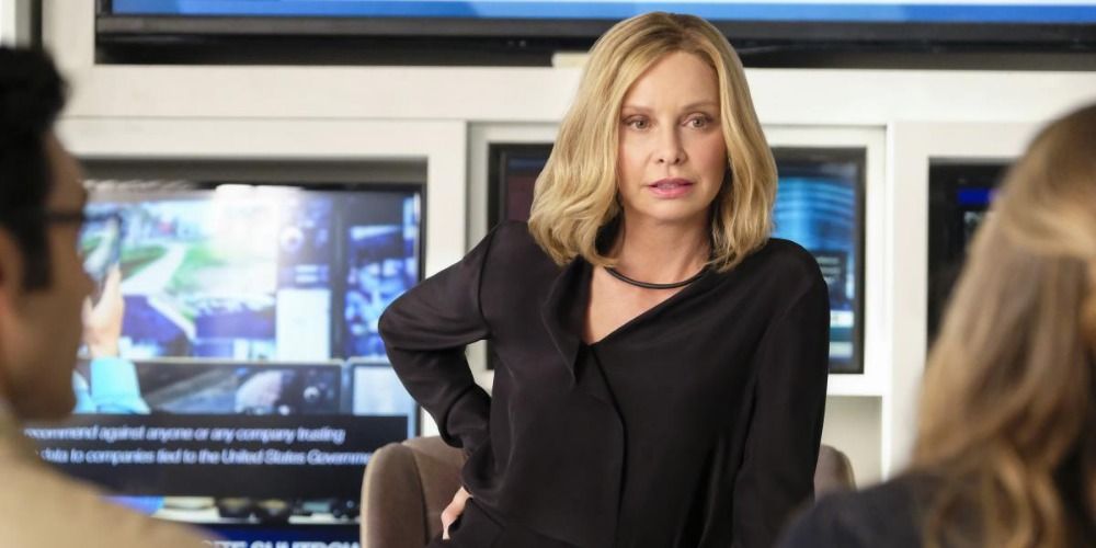 Cat Grant in Supergirl with her hand on her hip.