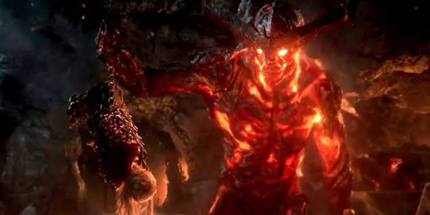 Surtur holding a chained up Thor.