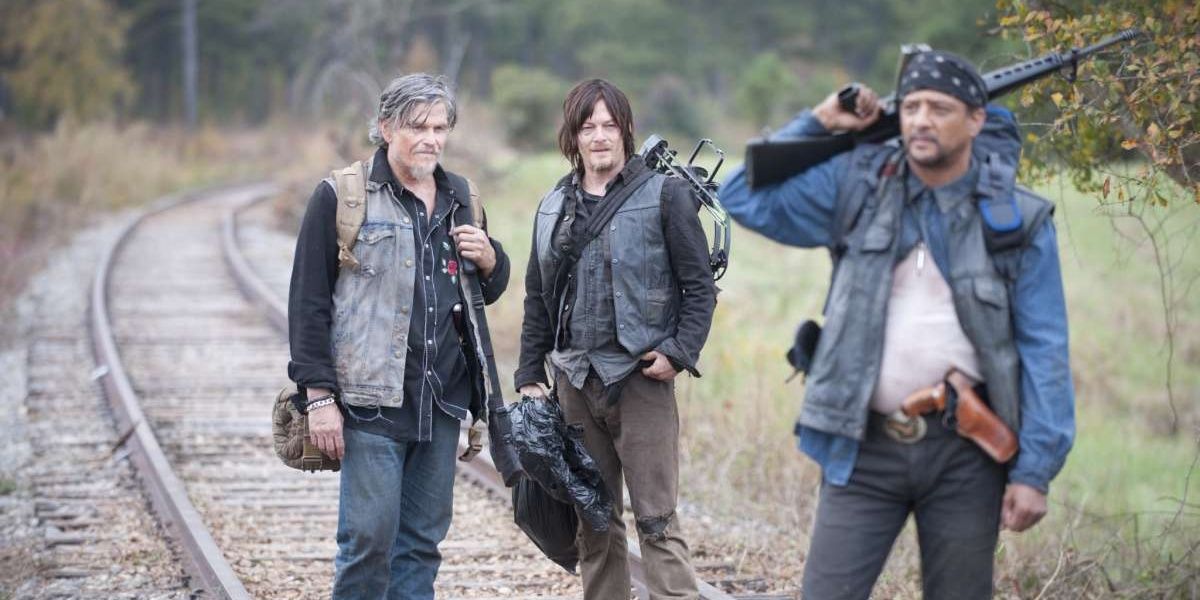 Daryl Joe and a Claimer walking on tracks in The Walking Dead