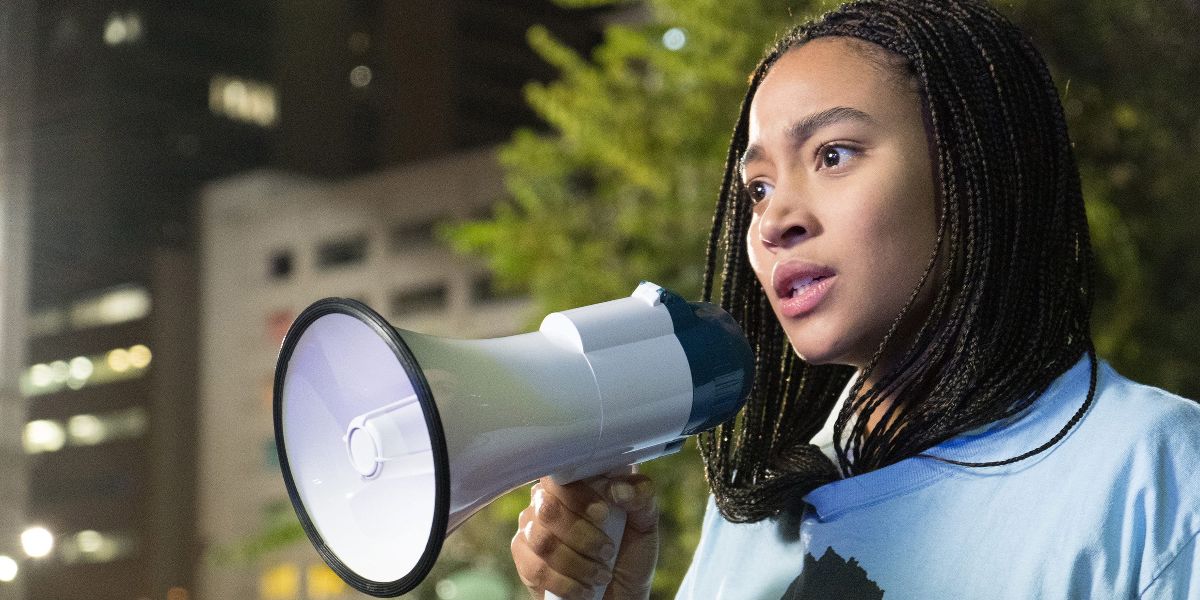 Starr using megaphone at protest in The Hate U Give