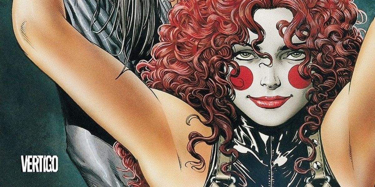 A woman in clown makeup hugs a man with silver hair and a mask in The Invisibles comic.