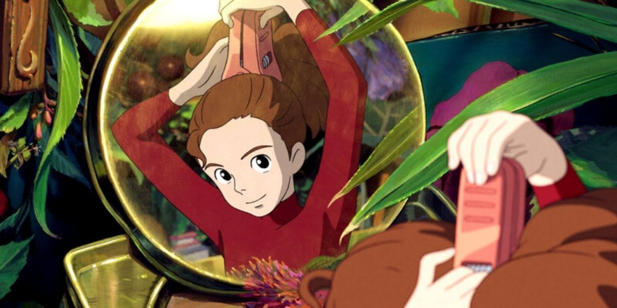 Arrietty ties up her hair while looking in a mirror in The Secret World Of Arrietty
