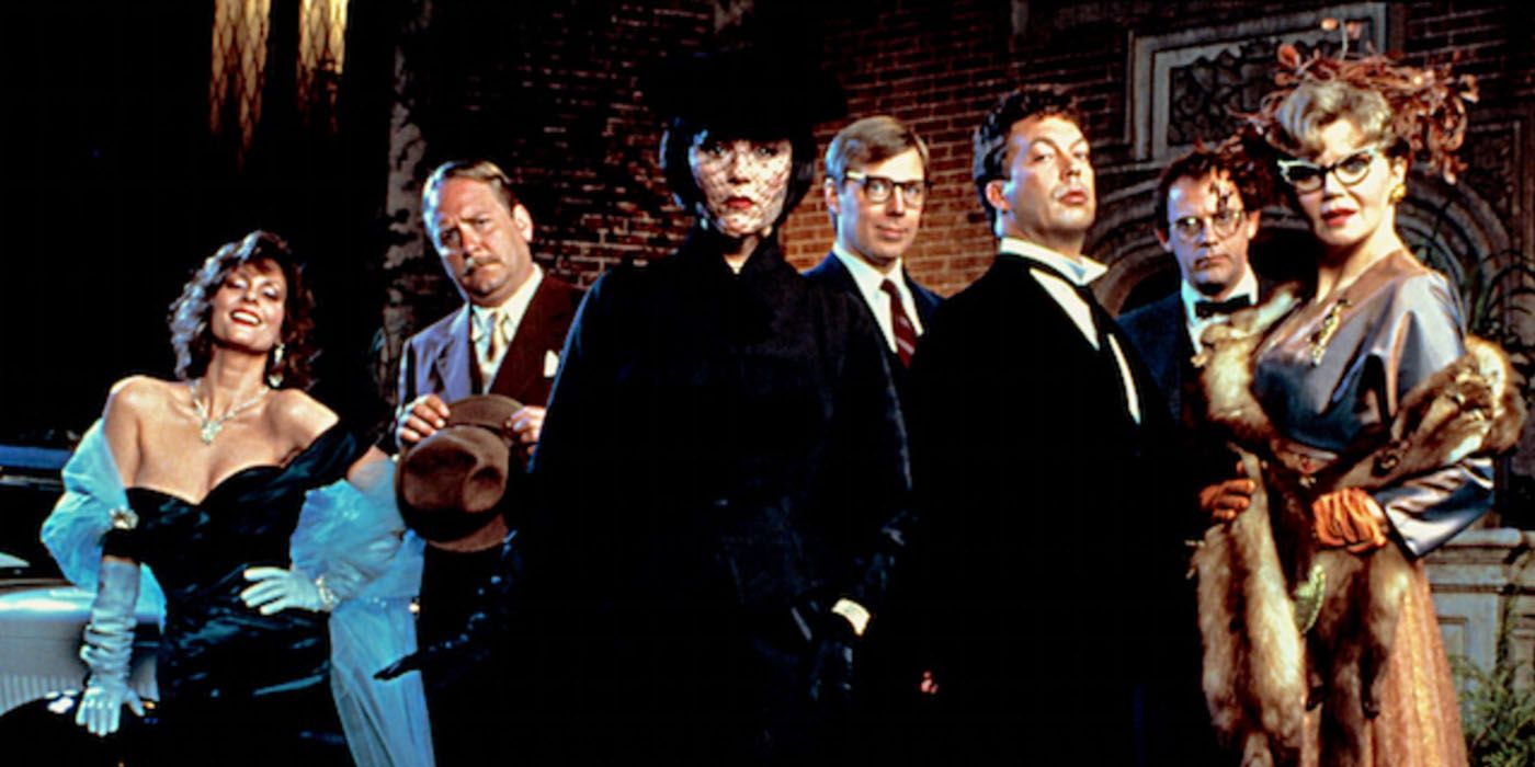 The cast of Clue posing for a photo.