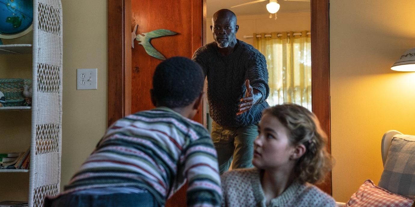 The commnity leader grabs his son and Regan after a creature attacks in A Quiet Place 2