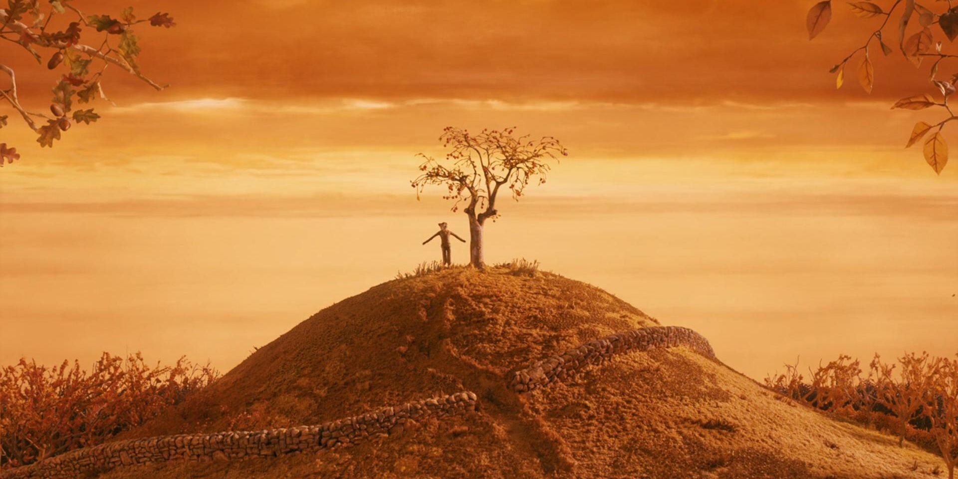 The opening shot of Fantastic Mr Fox with Mr Fox standing on a hill