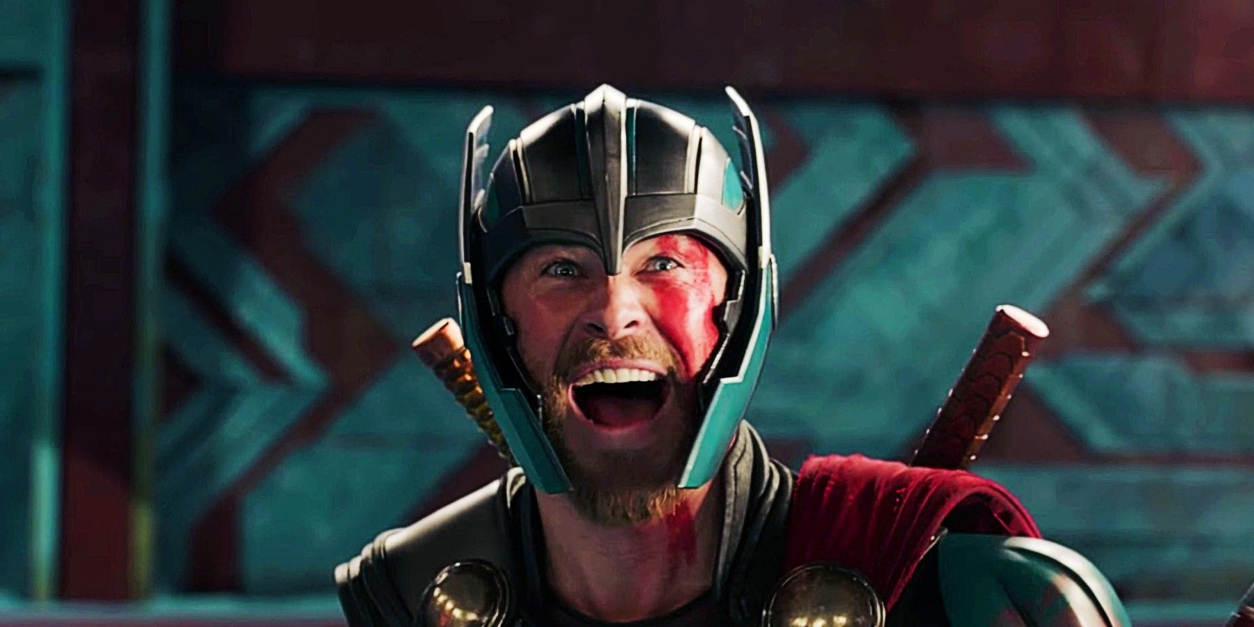 Thor laughing as he prepares for battle in Thor: Ragnarok.