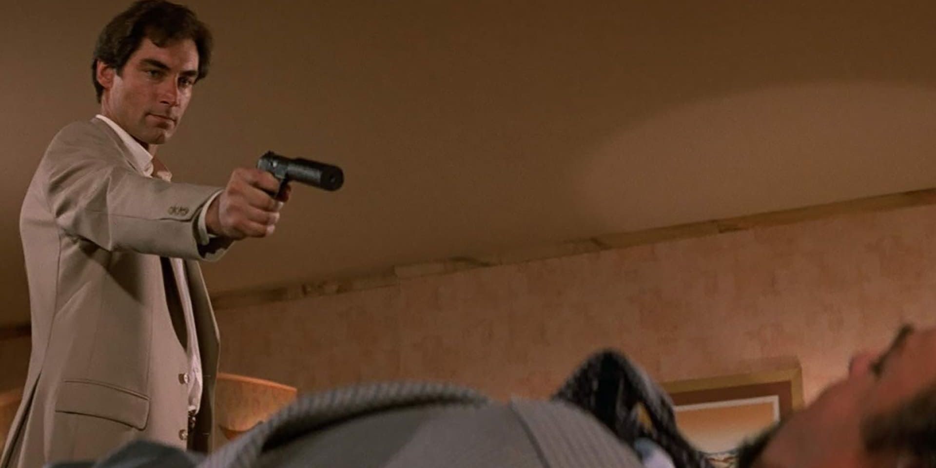 Timothy Dalton as Bond killing a villain in The Living Daylights