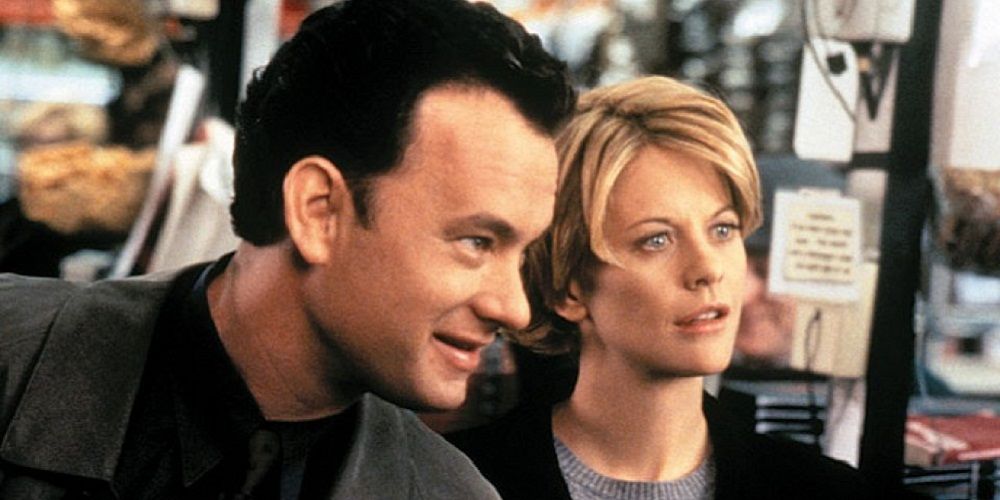Tom Hanks and Meg Ryan looking off-screen in You've Got Mail