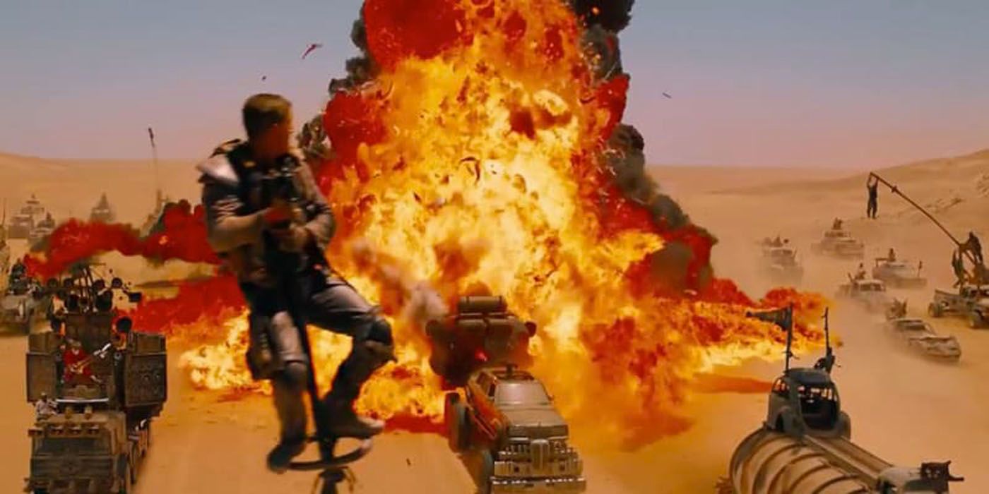 Max swinging by in front of Mad Max Fury Road explosion.