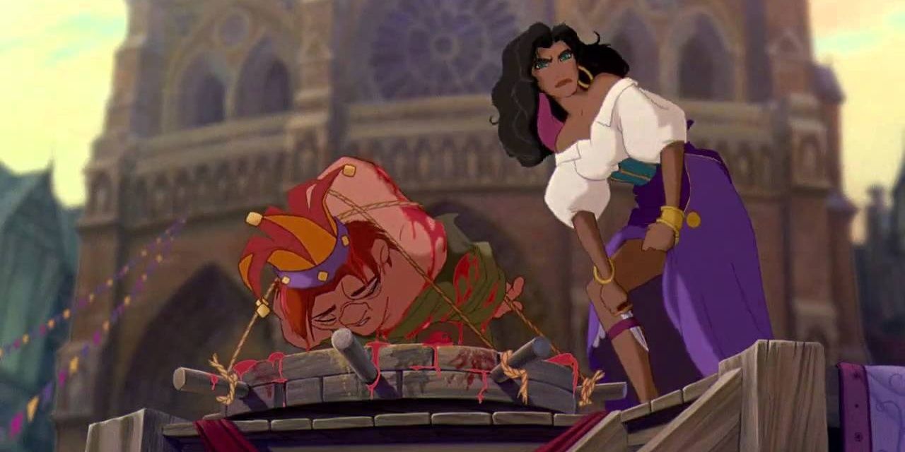 An image of Esmeralda protecting Quasimodo on Topsy Turvy Day in The Hunchback of Notre Dame.