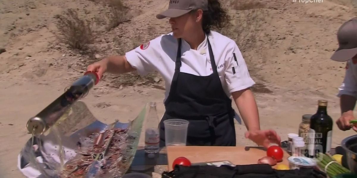 A female chef cooking using solar-powered equipment