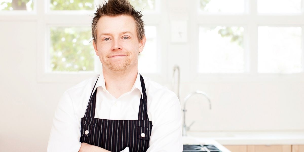 Richard Blais posing for a photo smiling with his arms crossed