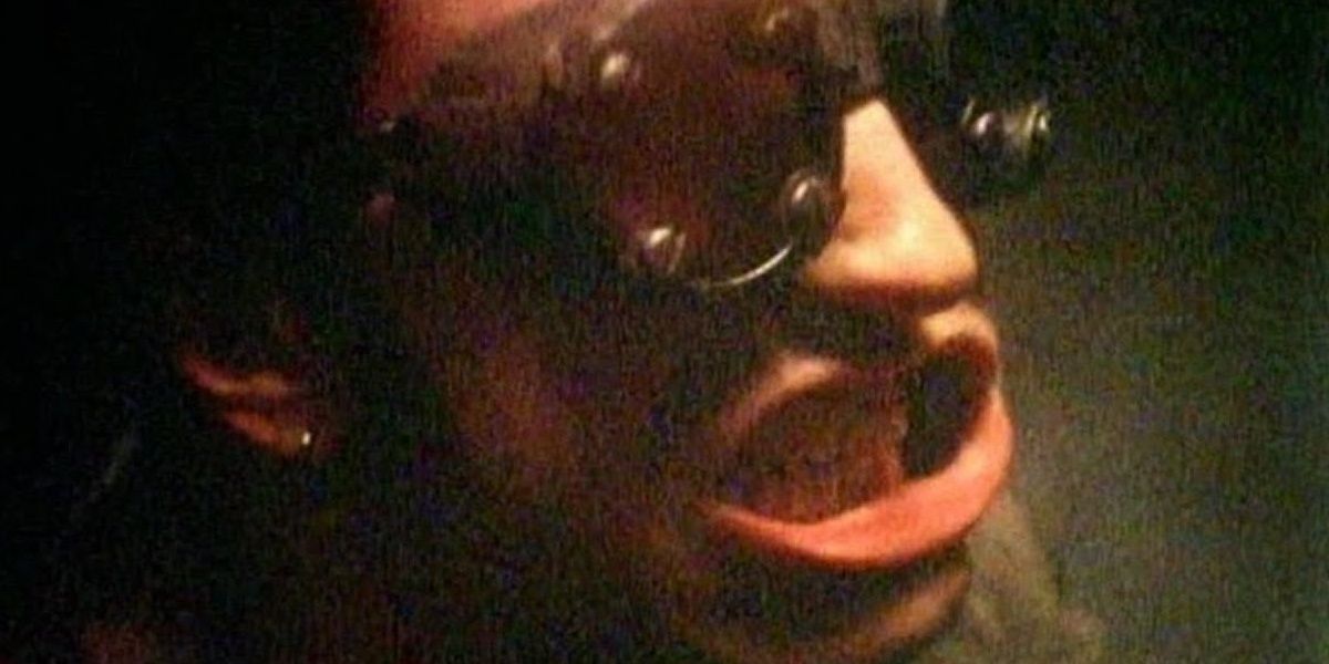 Trent Reznor gritting his teeth and wearing aviator goggles in a still from Closer.