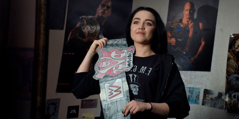Florence Pugh wearing a wrestling belt in Fighting With My Family 