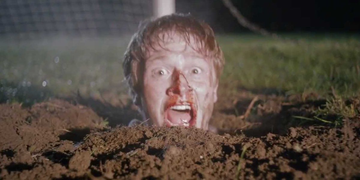 Billy with head stuck in ground screaming in Wrong Turn 5.