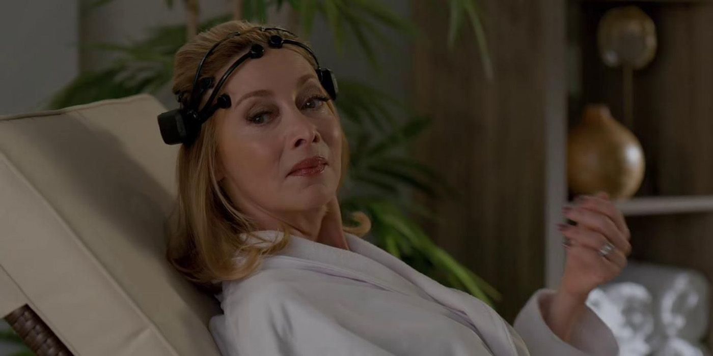 Laura Van Kirk from Dynasty relaxing with a contraption on her head.