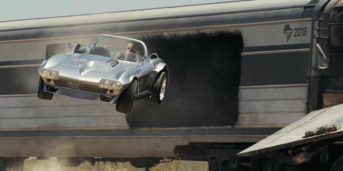 Dom drives a car out of a train in Fast Five