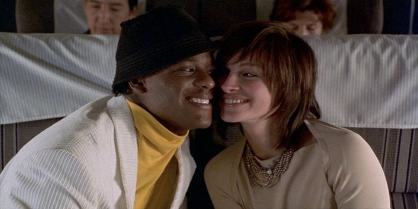 Julia Roberts and Blair Underwood smiling at one another in Full Frontal