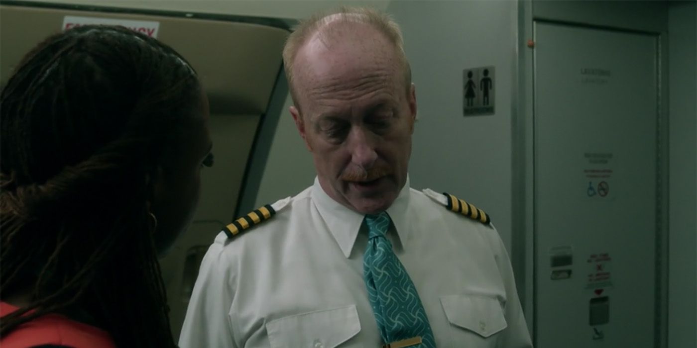 Captain Bill Daly from Flight 828 on Manifest on the plane talking with a flight attendant.