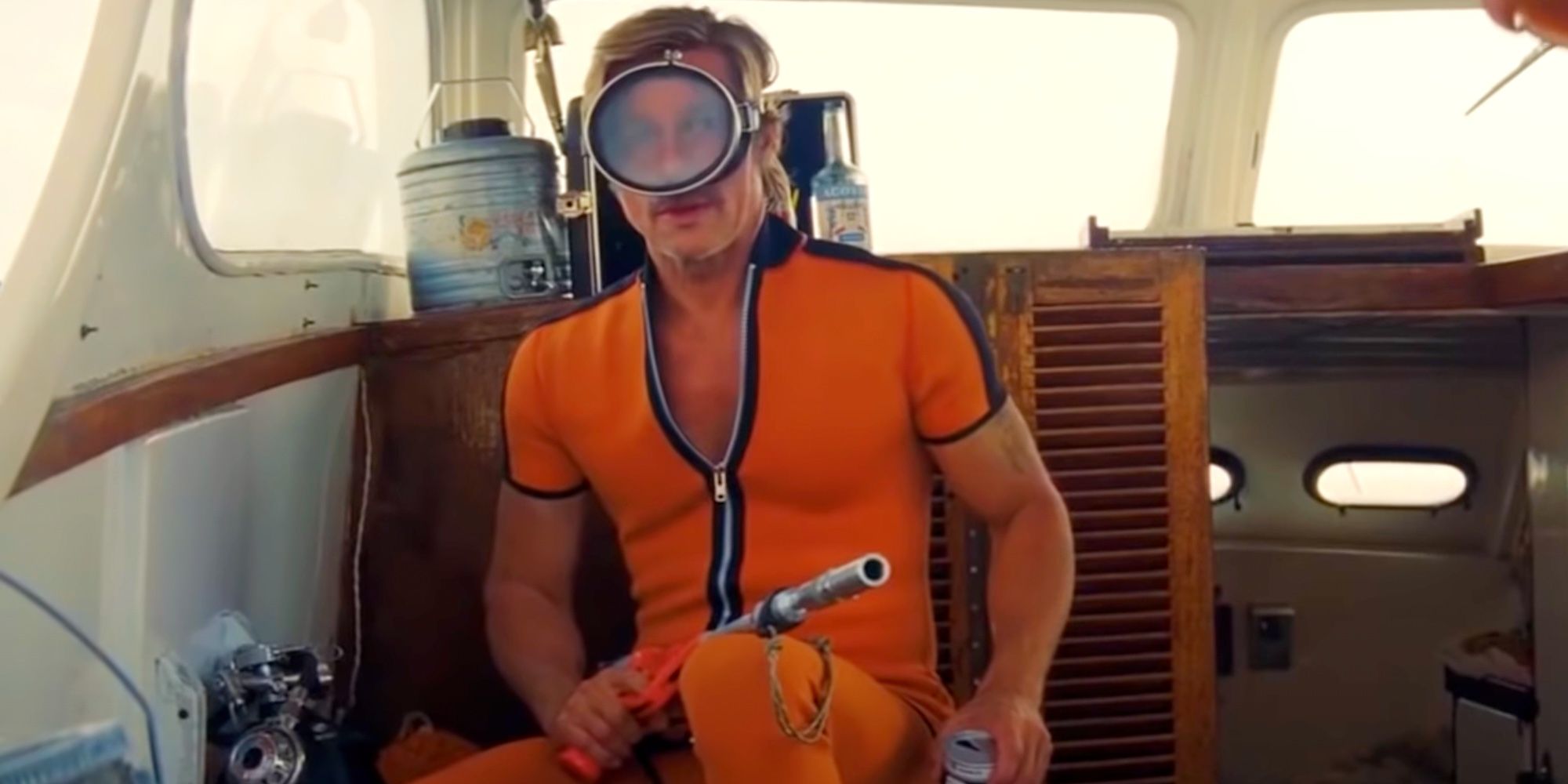 Cliff holds a shark gun on a boat in Once Upon A Time In Hollywood